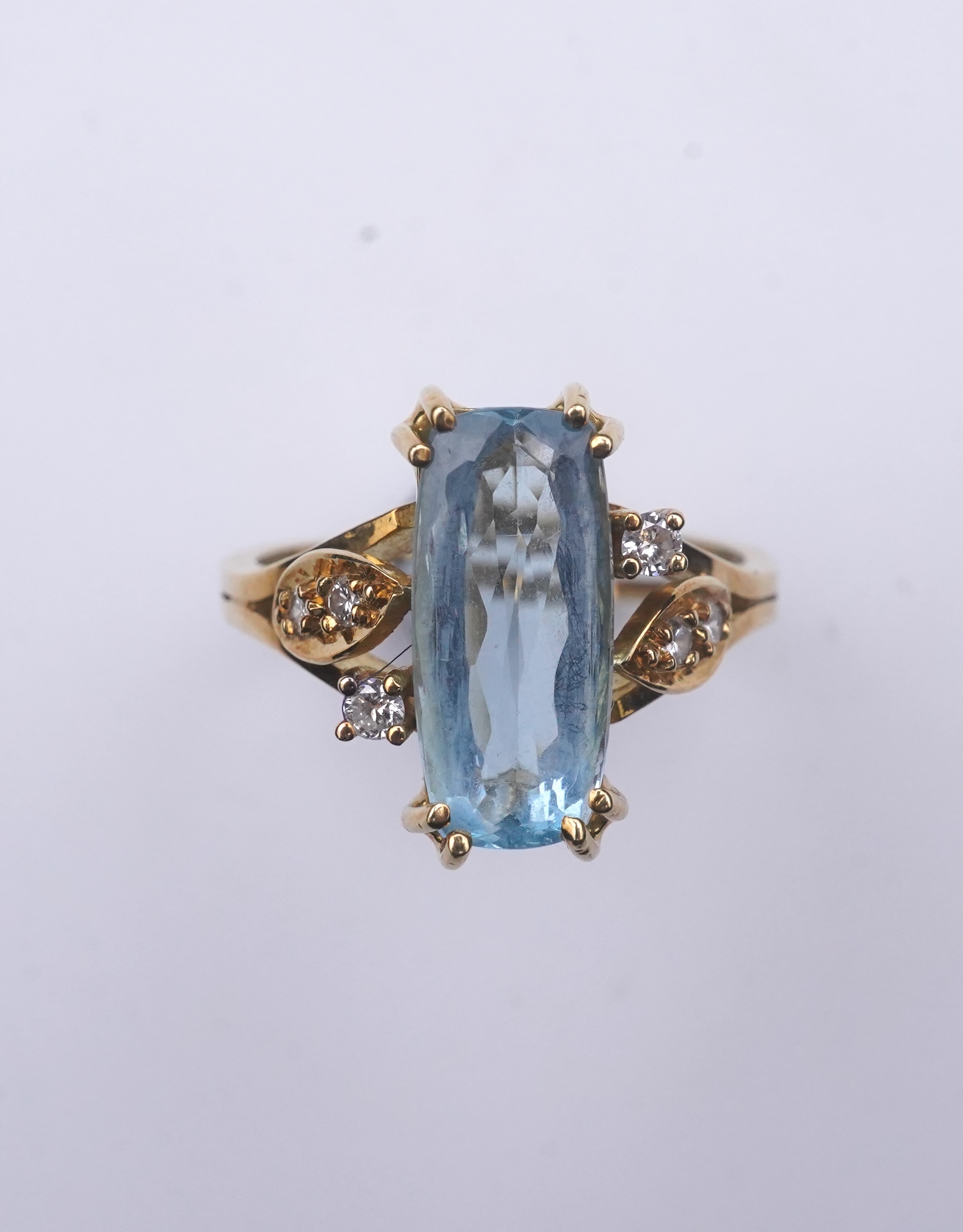 An aquamarine and diamond ring
